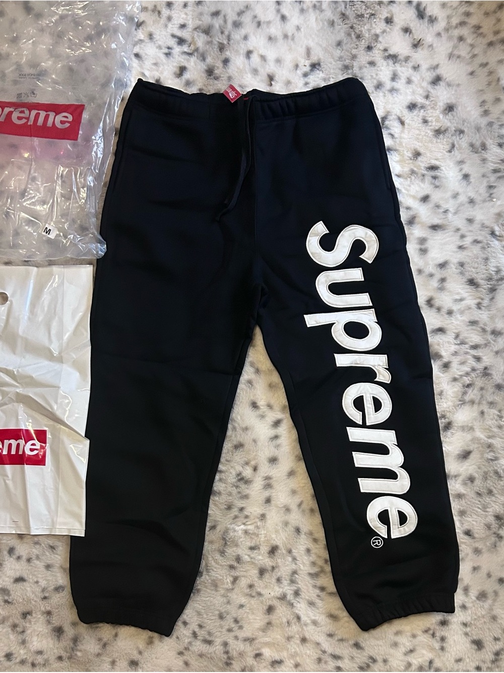 Supreme Black Sweatpants with White Vertical Logo